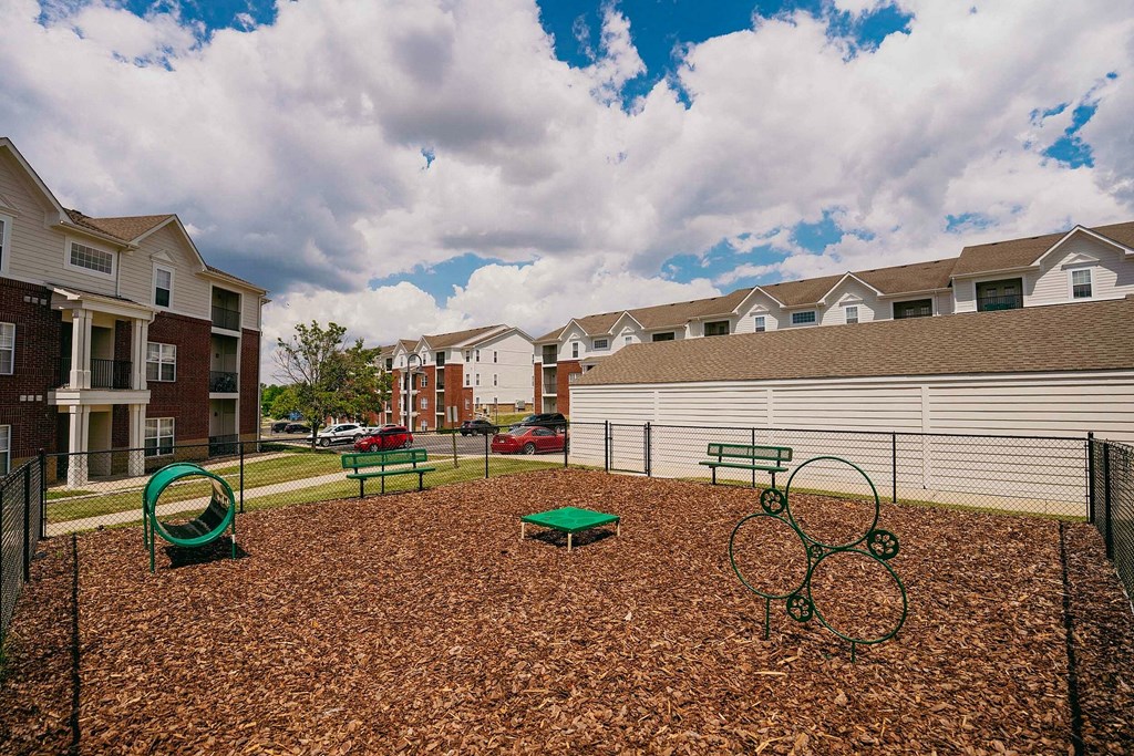 a laundry room with washer and dryer and a chair