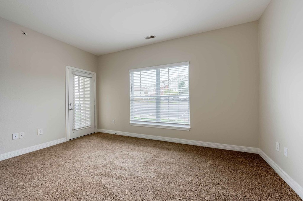 the front of a building with a parking lot