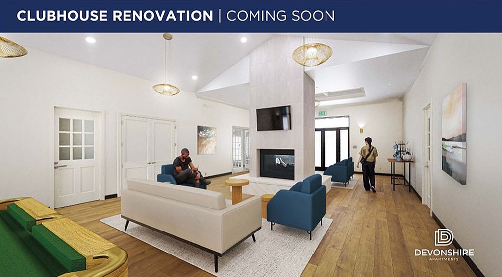 A room with a fireplace and a ceiling fan.