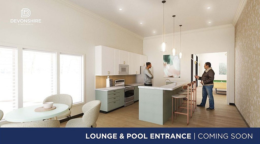 A living room with a fireplace and a ceiling fan.