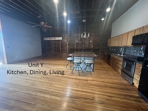 A kitchen, dining, and living area in Unit Y.