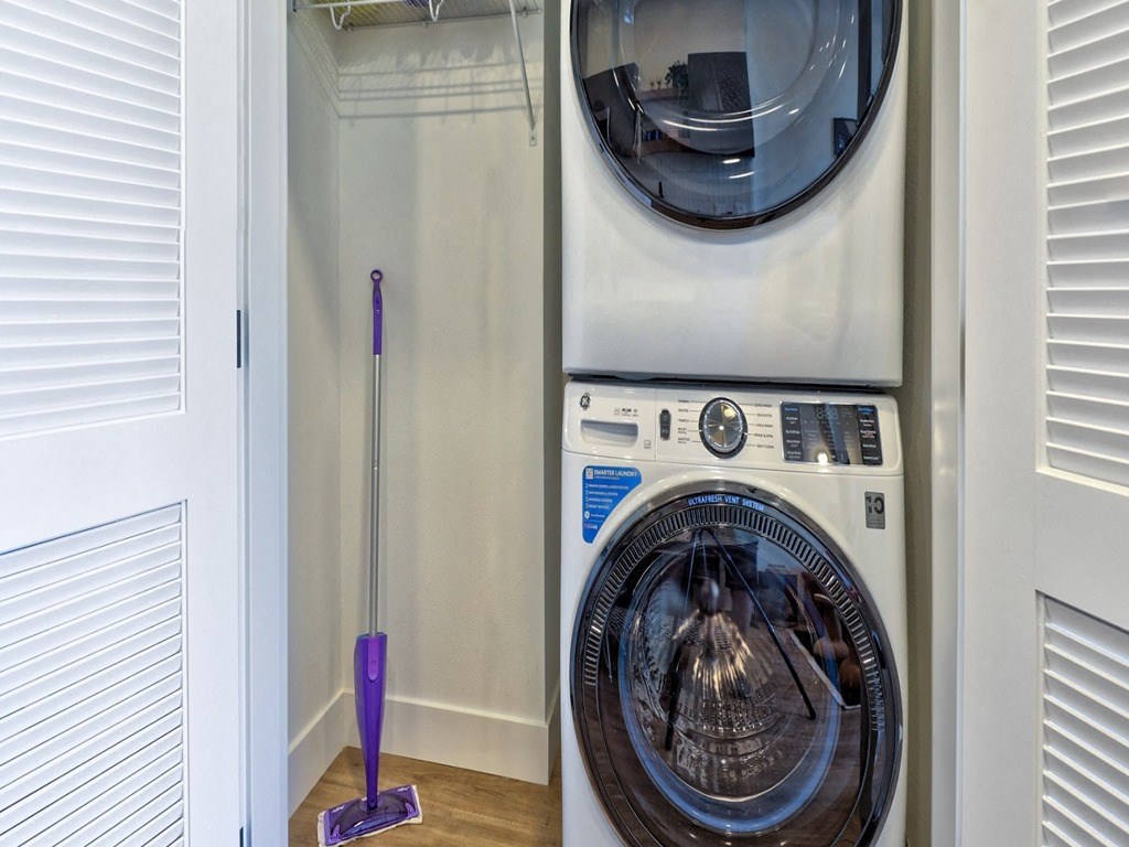 a washing machine and dryer in a small room
