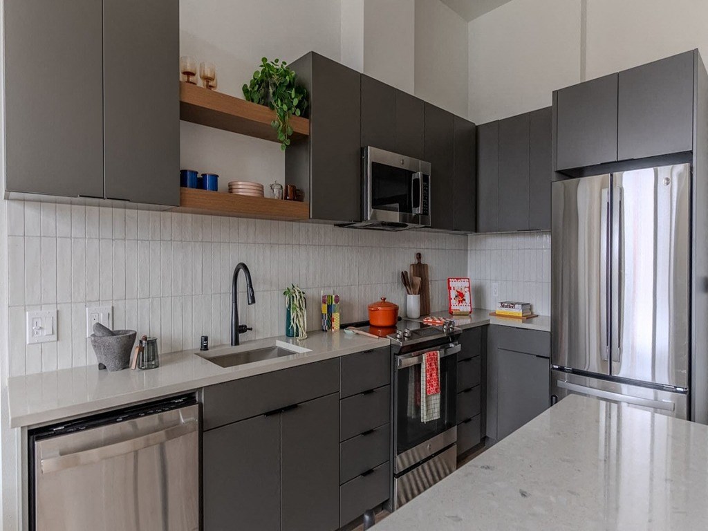 a kitchen with a sink and a refrigerator