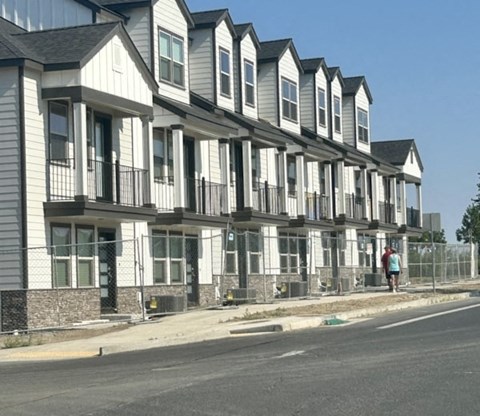 a row of houses on the side of a street
