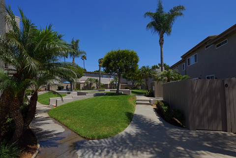 A residential area with a clear blue sky.