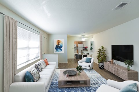 a living room with a white couch and a coffee table