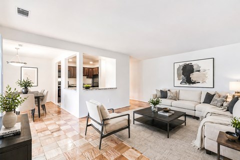 the living room is open to the dining room and kitchen