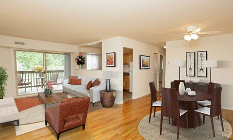 a living room and dining room with a couch and a table