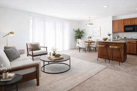 a living room and kitchen with a couch and a table