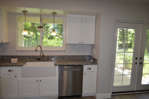 a kitchen with a sink and a window