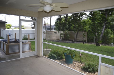 a view of the backyard from the porch of a house