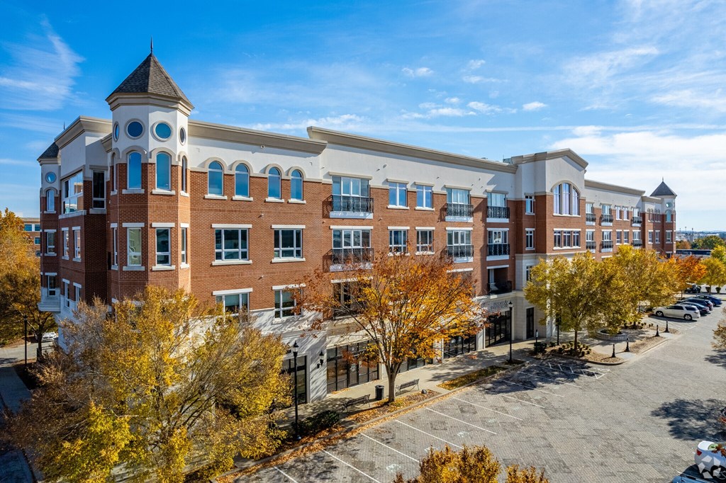 A large multi-story building with a clock tower on the top floor.