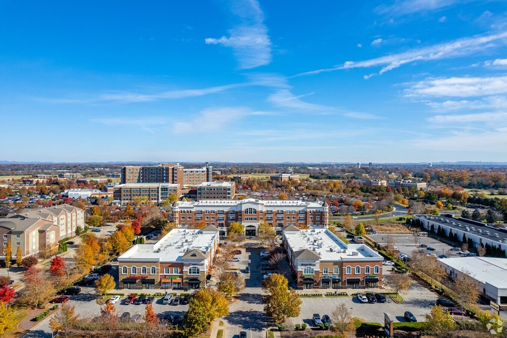 A view of a town with buildings and trees.