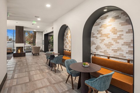 A modern dining area with a table set for two.
