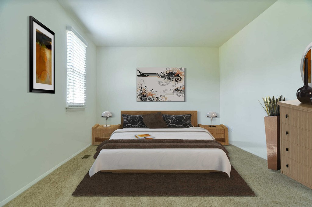 a bedroom with a bed and a dresser