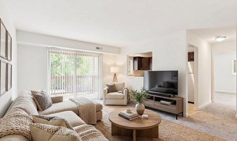 A bedroom with a large bed and a television.