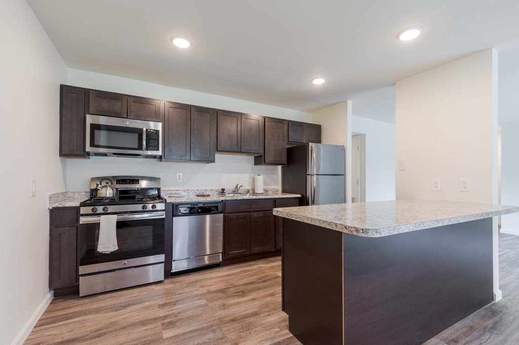 A grassy area in front of a brick building.