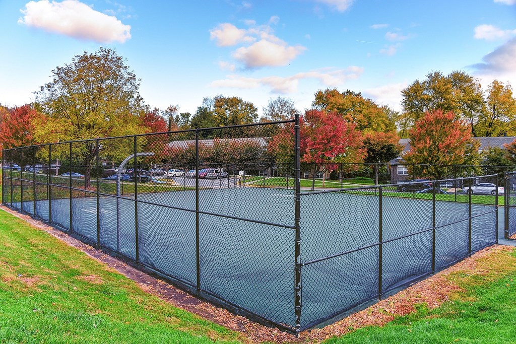 a kitchen with wood cabinets and white appliances and a counter top