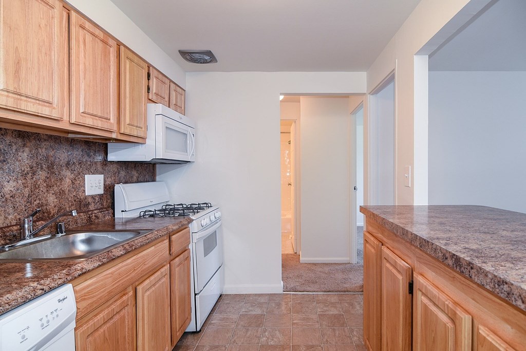 a kitchen with granite countertops and a sink