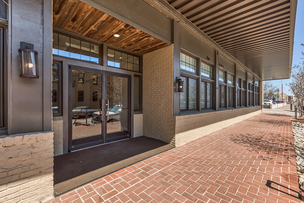 A building with a wooden ceiling and glass doors.