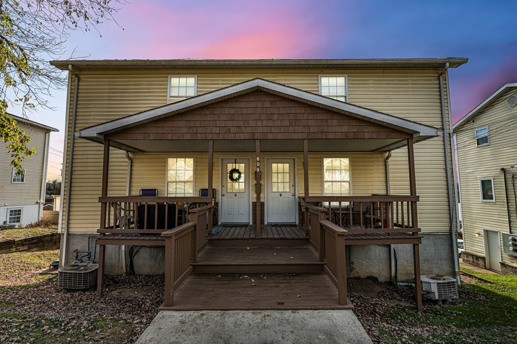 A house with a porch and a covered entrance.