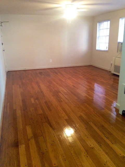 a living room with a hard wood floor