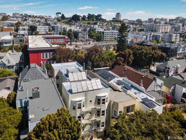 A bird's eye view of a city with buildings and trees.