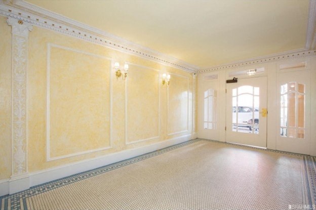 A room with a checkered floor and a door.