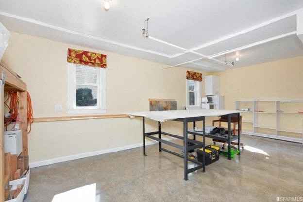 A room with a table and chairs in it.