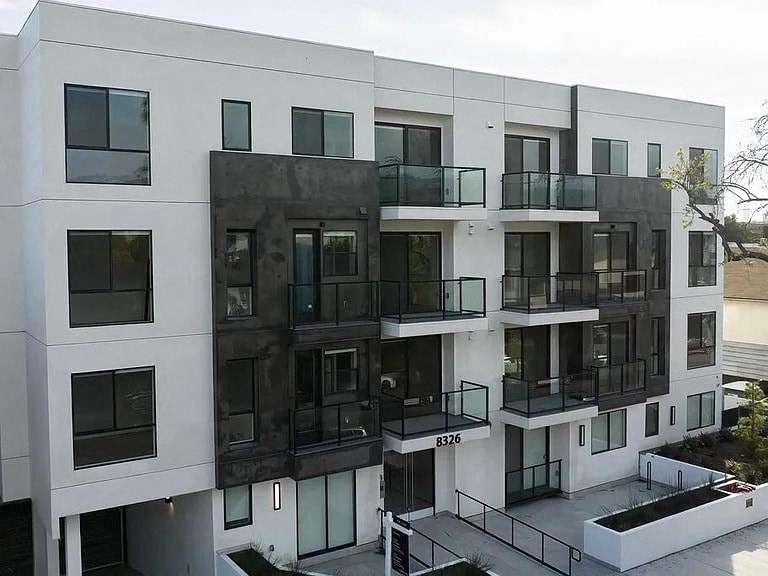 a building with a lot of windows and balconies