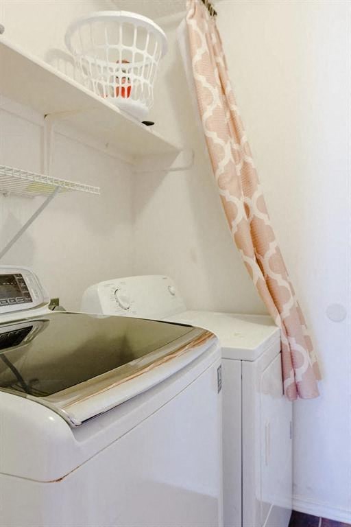 a white kitchen with a sink and a washing machine