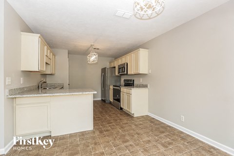 a kitchen with a counter top and a refrigerator