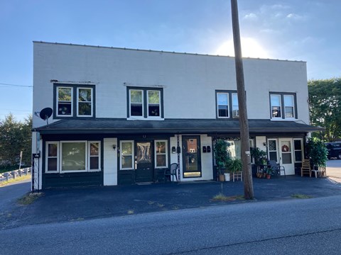 a white building on the side of a road