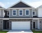 A two-story house with a garage.