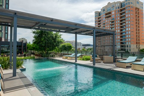 A large swimming pool with a walkway over it.