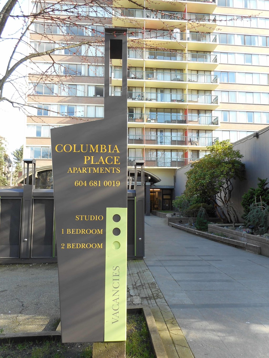 Columbia Place Apartments sign in front of a building.