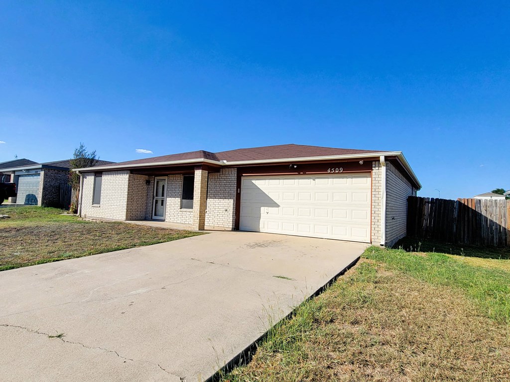a house with a driveway and a garage door