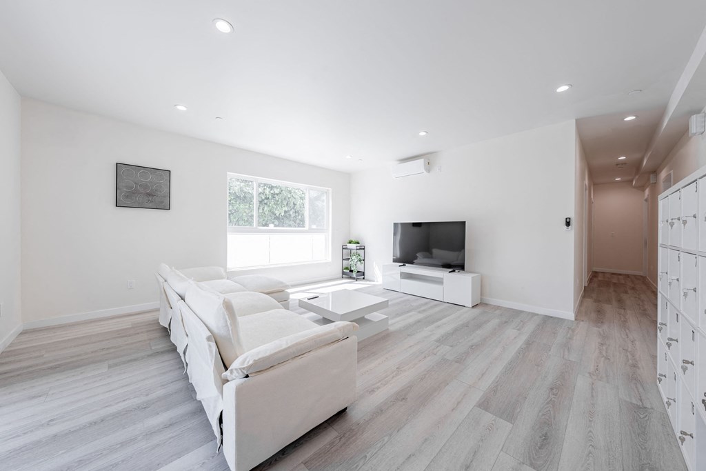 a living room with a couch and a tv