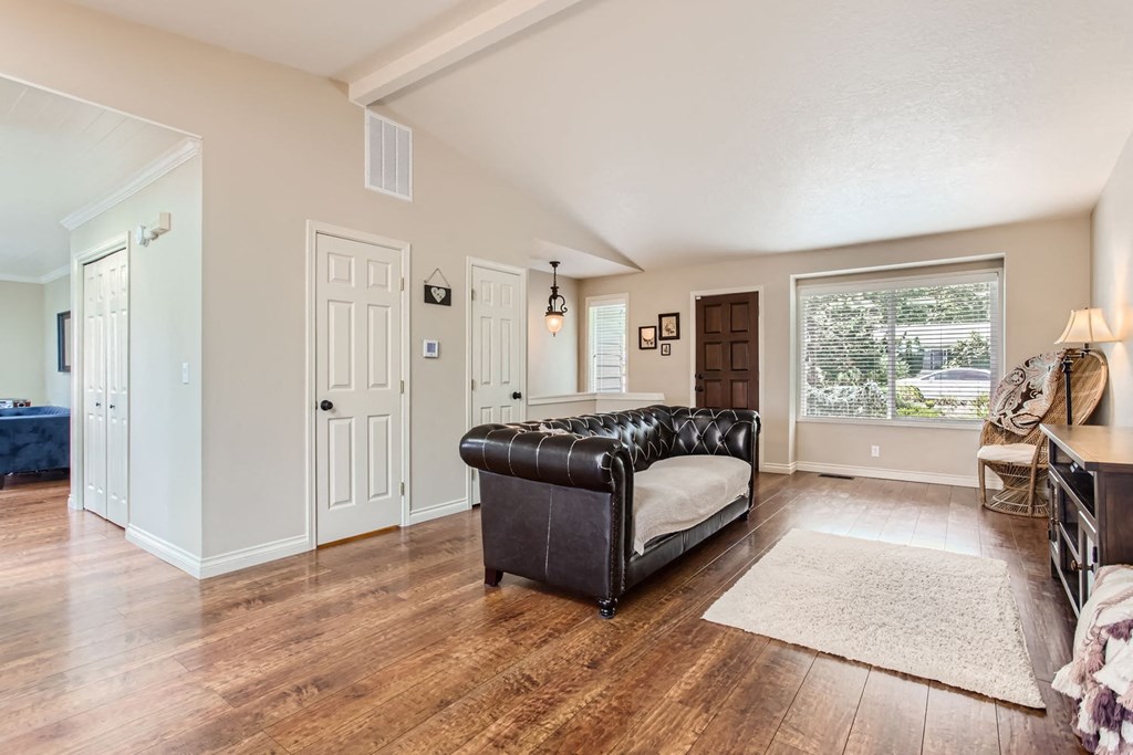 a living room with a couch and a window