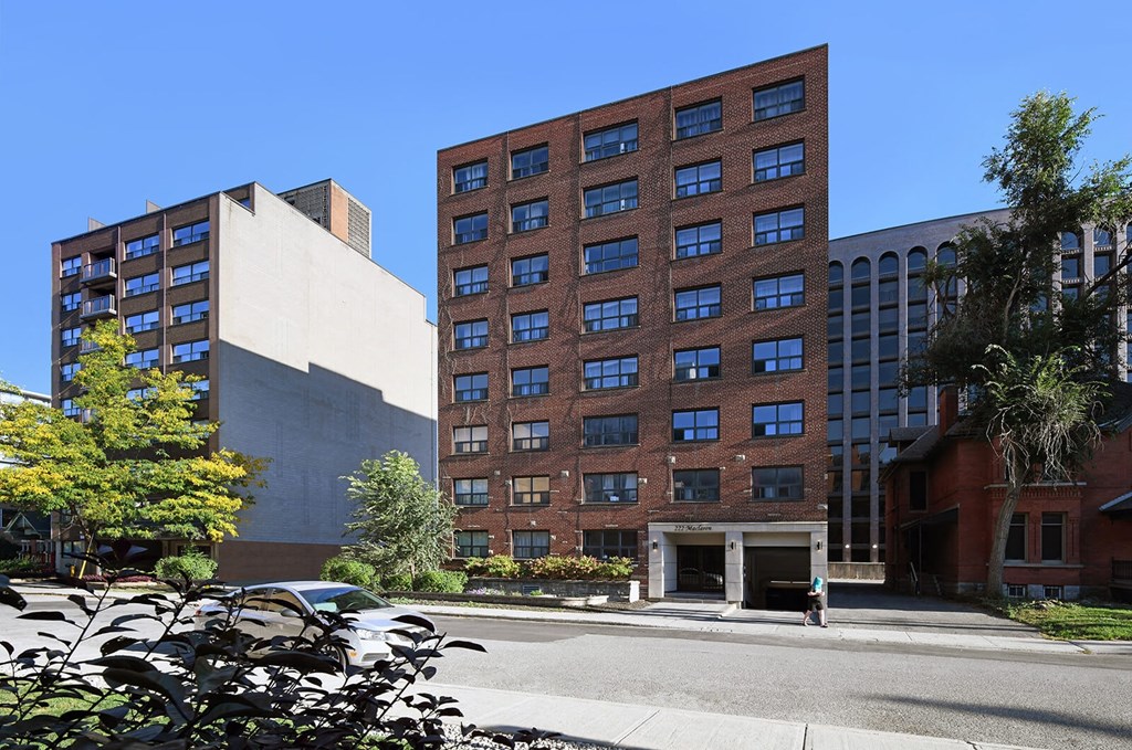 a tall building with a street in front of it