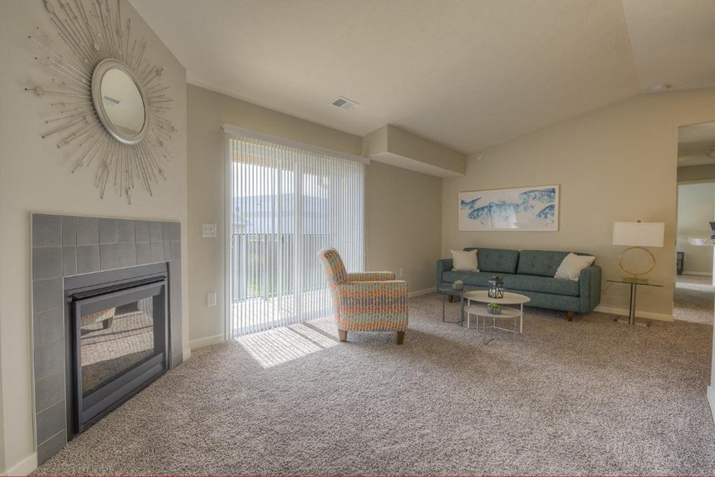 a living room with a fireplace and a couch