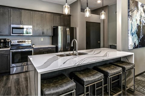 a kitchen with a marble counter top