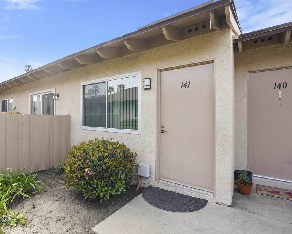 A house with the number 141 on the door.