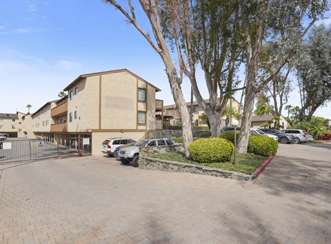 A building with a parking lot in front of it.