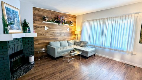 A living room with a fireplace and a couch.