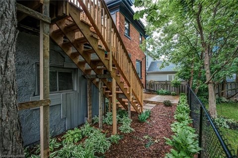 A wooden staircase leads up to a building.