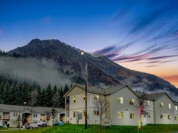 A mountain with a building in front of it.