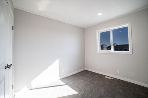 A room with a window and a door.