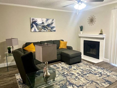 a living room with a couch and a fireplace