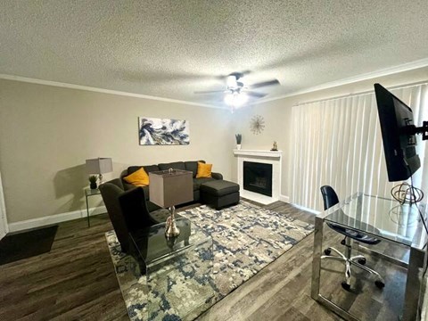 a living room with a couch and a tv